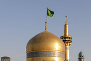 آیین تعویض پرچم گنبد حرم مطهر رضوی در روز ولادت امام رضا(ع)